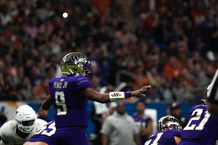 Washington Huskies quarterback Michael Penix Jr. (9) lines up the offense for a snap against Texas during the Alamo Bowl at the Alamodome, Thursday, Dec. 29, 2022 in San Antonio. Aem Tx Vs Wu Alamo Bowl 9